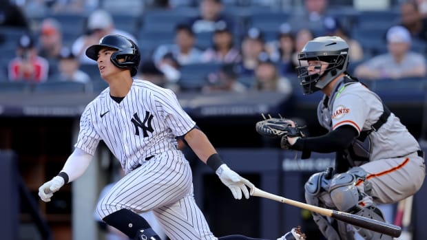 Apr 1, 2023; Bronx, New York, USA; New York Yankees shortstop Anthony Volpe (11) follows through on a single against the San Francisco Giants during the second inning at Yankee Stadium. The hit was hit first major league hit.
